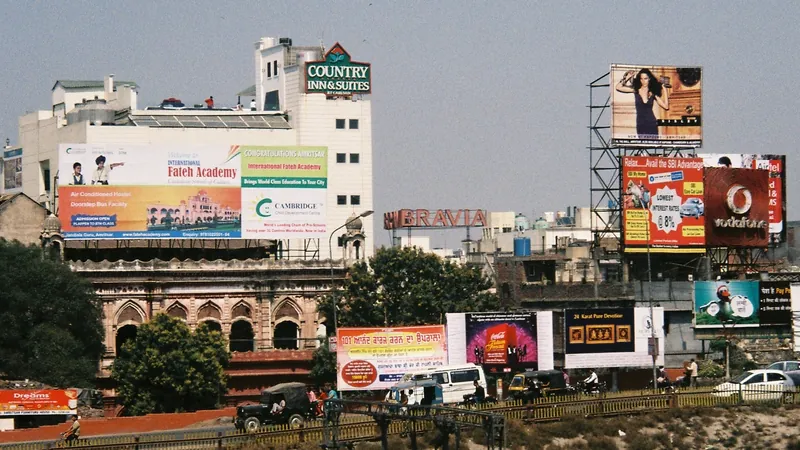 A city skyline crowded with dozens of competing advertising hoardings stacked above the rooftops